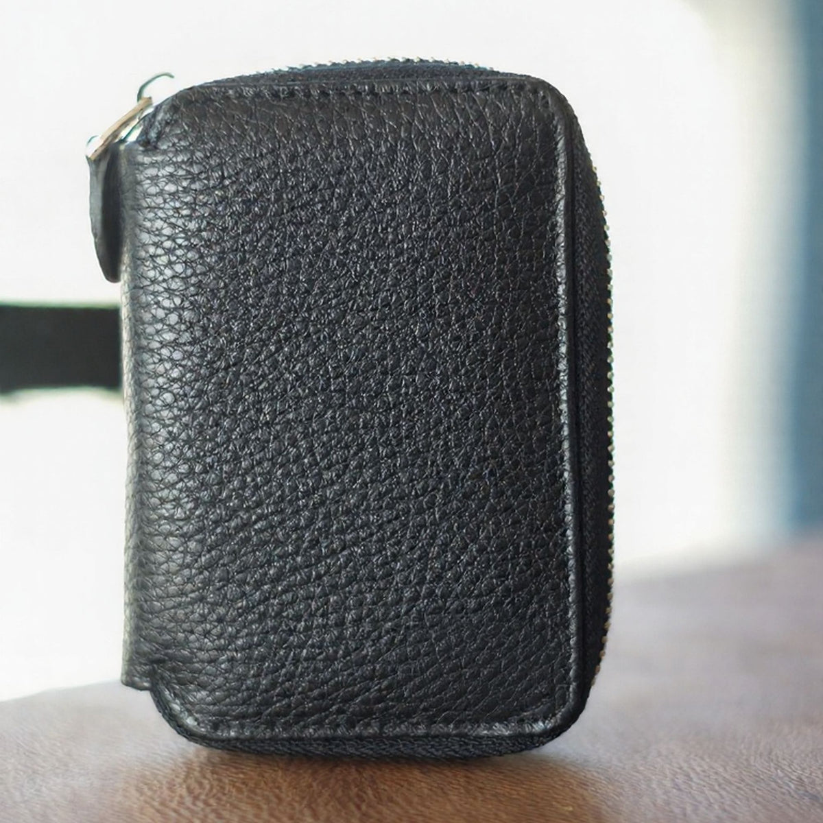 Vanguard handcrafted black Crazy Horse leather zip-around wallet front view - Yubello