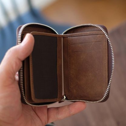 Vanguard handcrafted leather zippered wallet open in hand showing card slots and mesh ID window - Yubello