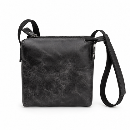 Corven handcrafted black Crazy Horse leather vertical crossbody messenger bag front view - Yubello