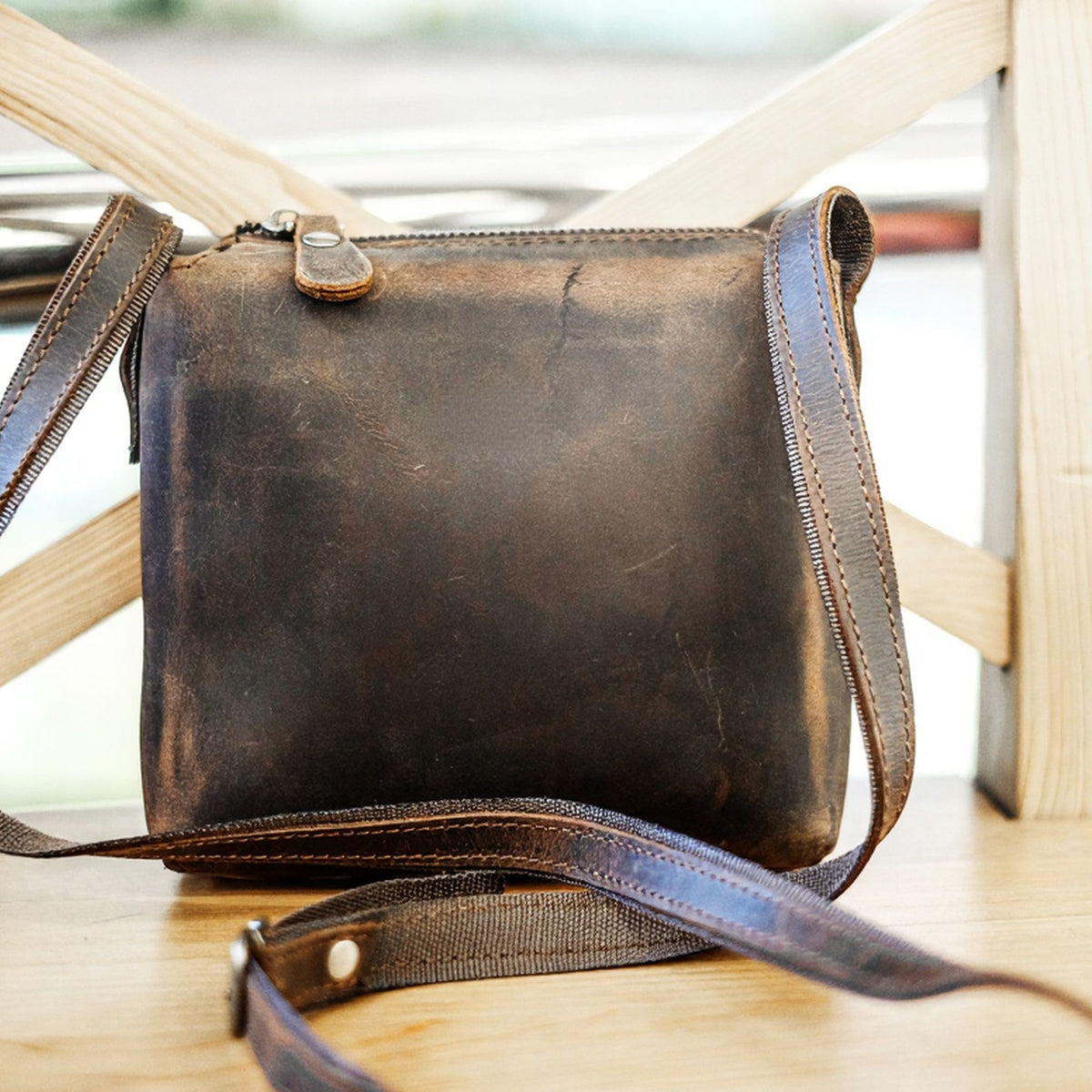 Corven handcrafted brown Crazy Horse leather vertical crossbody messenger bag front view - Yubello