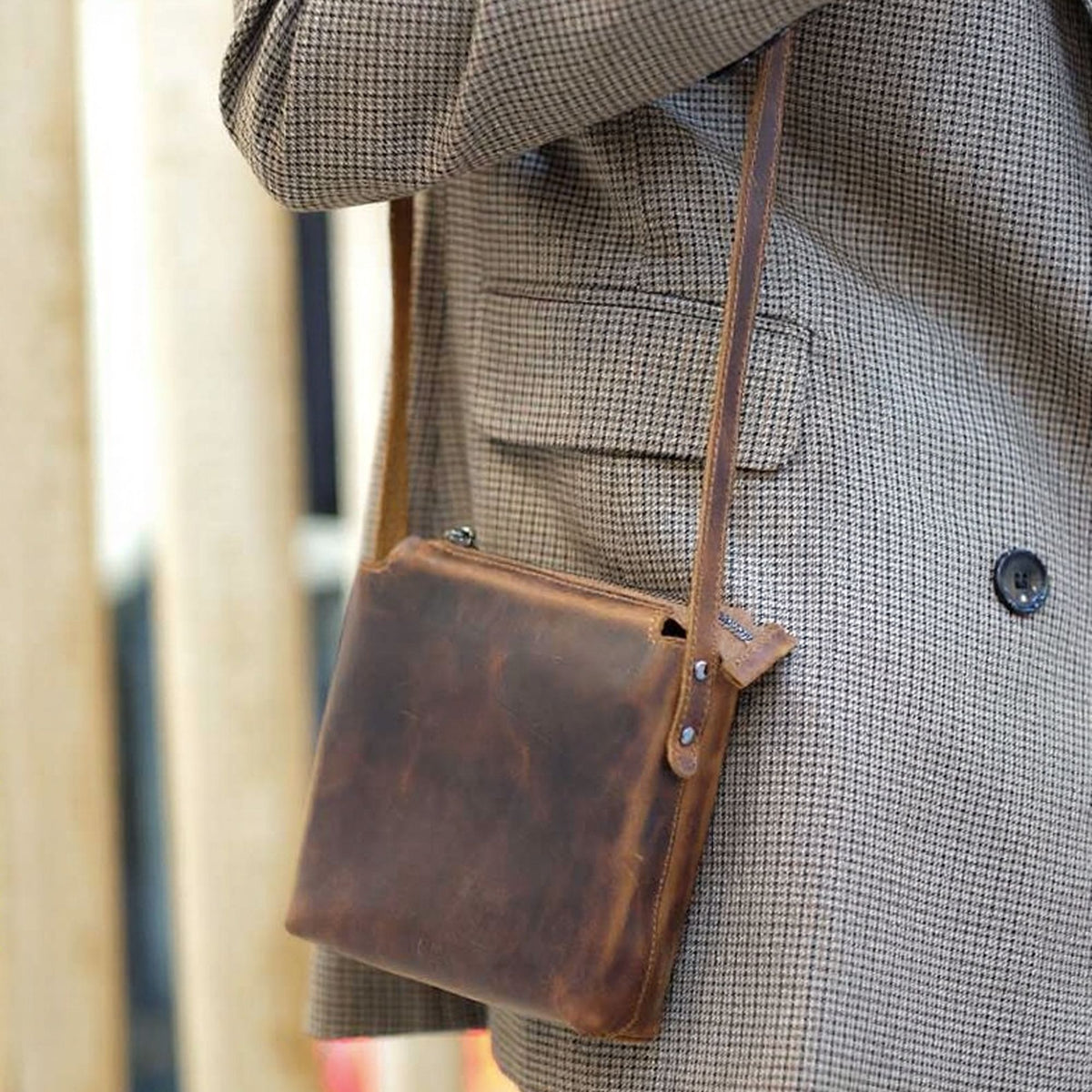 Corven handcrafted brown Crazy Horse leather vertical crossbody messenger bag front view - Yubello