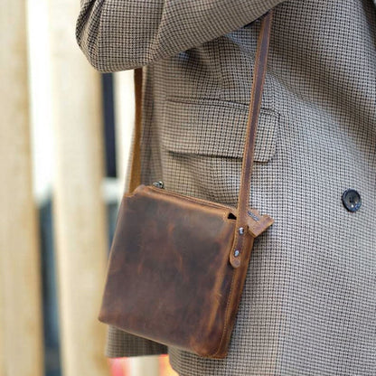 Corven handcrafted brown Crazy Horse leather vertical crossbody messenger bag front view - Yubello