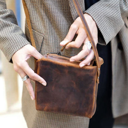 Corven handcrafted brown Crazy Horse leather vertical crossbody messenger bag front view - Yubello