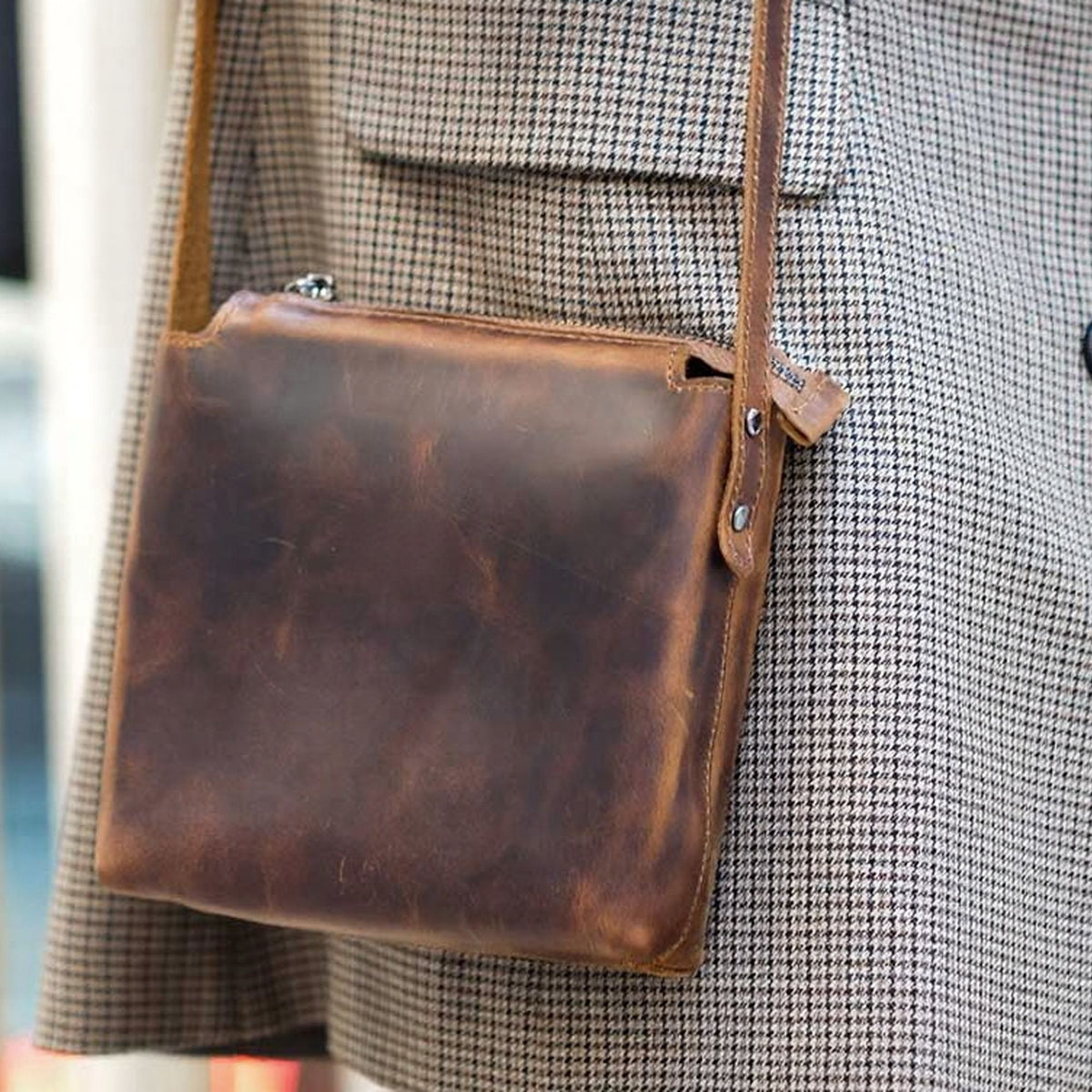 Corven handcrafted brown Crazy Horse leather vertical crossbody messenger bag front view - Yubello