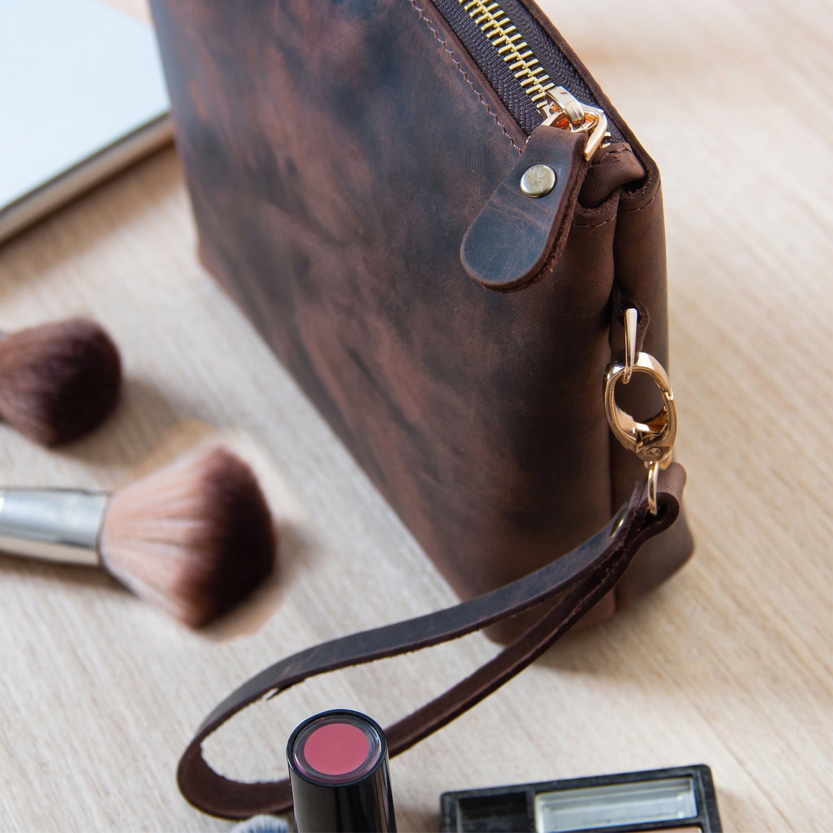 Meridian handcrafted dark brown leather wristlet clutch bag with zipper front view - Yubello