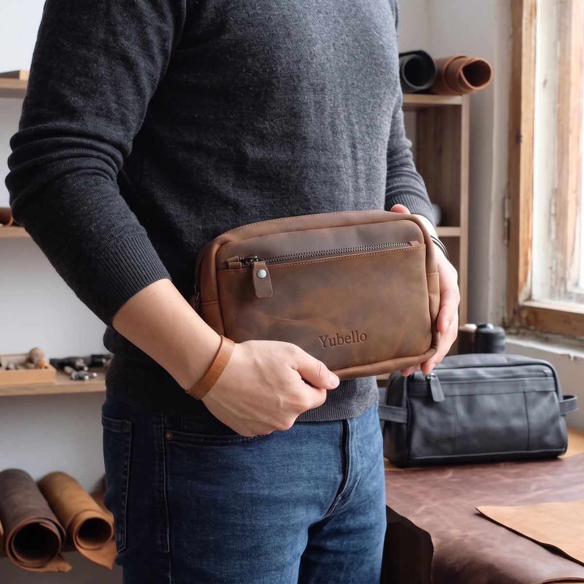 Nolen handcrafted brown leather organizer pouch back view with integrated hand strap - Yubello