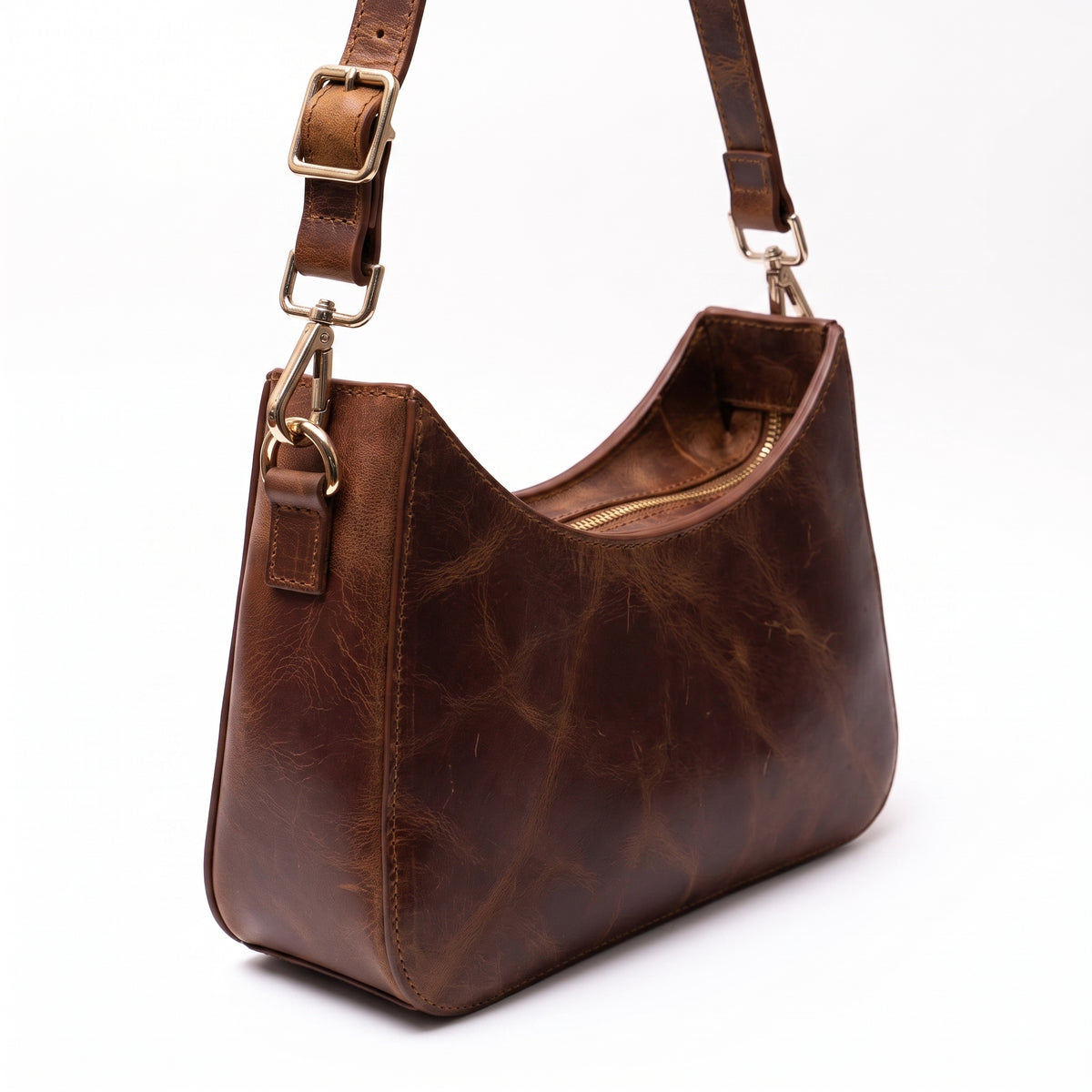 Norelle handcrafted brown Crazy Horse leather crescent shoulder bag front view - Yubello