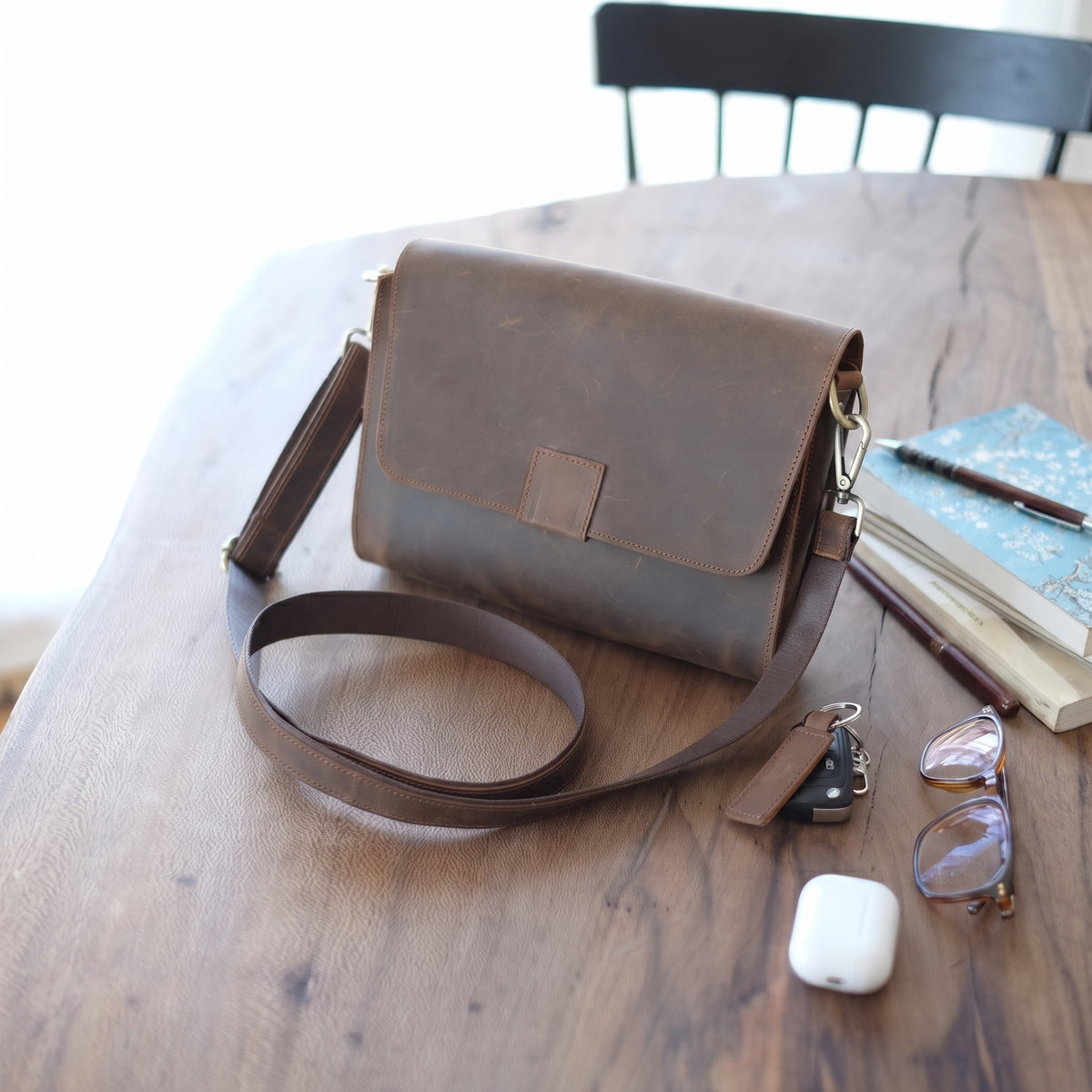 Novan handcrafted dark brown leather compact messenger bag crossbody purse front view - Yubello