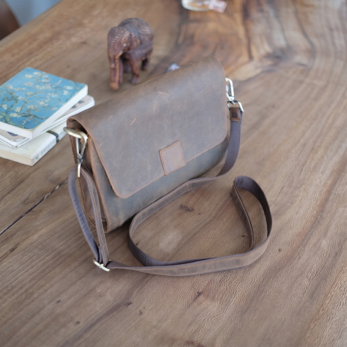 Novan handcrafted  brown leather compact messenger bag crossbody purse front view - Yubello
