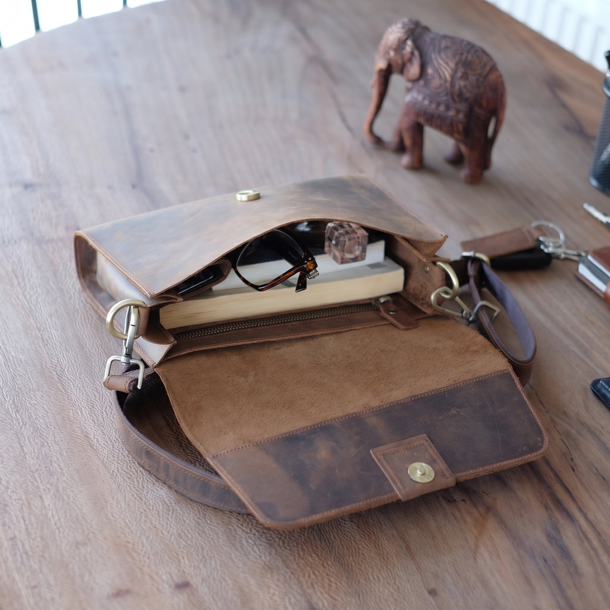Novan handcrafted brown leather compact messenger bag crossbody purse front view - Yubello
