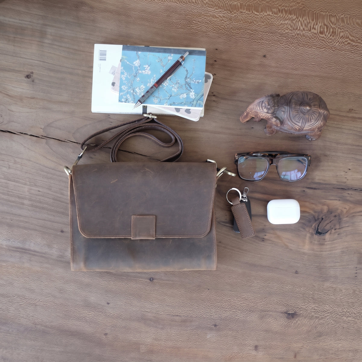 Novan handcrafted  brown leather compact messenger bag crossbody purse front view - Yubello
