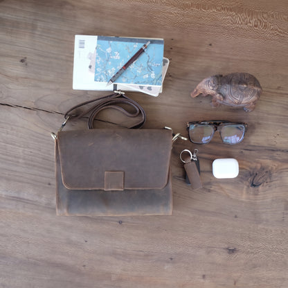 Novan handcrafted  brown leather compact messenger bag crossbody purse front view - Yubello