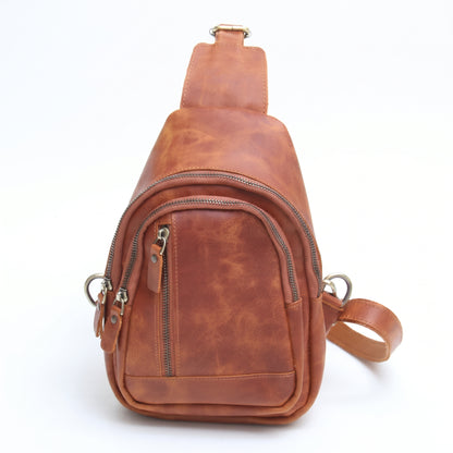 Orvik handcrafted tan brown leather teardrop sling bag multi-zip chest backpack front view - Yubello