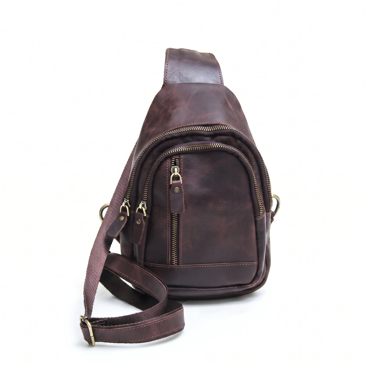 Orvik handcrafted chestnut leather teardrop sling bag multi-zip chest backpack front view - Yubello