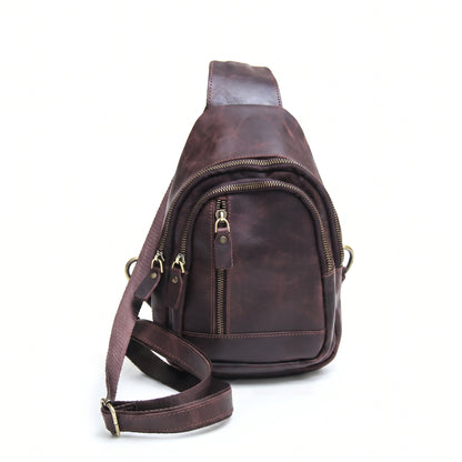 Orvik handcrafted chestnut leather teardrop sling bag multi-zip chest backpack front view - Yubello