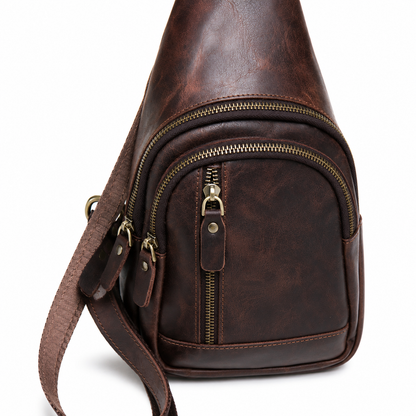 Orvik handcrafted tan brown leather teardrop sling bag multi-zip chest backpack front view - Yubello