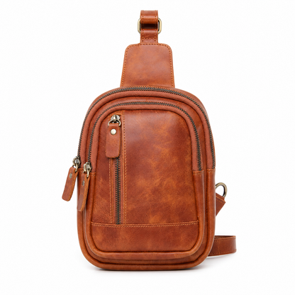 Orvik handcrafted tan brown leather teardrop sling bag multi-zip chest backpack front view - Yubello