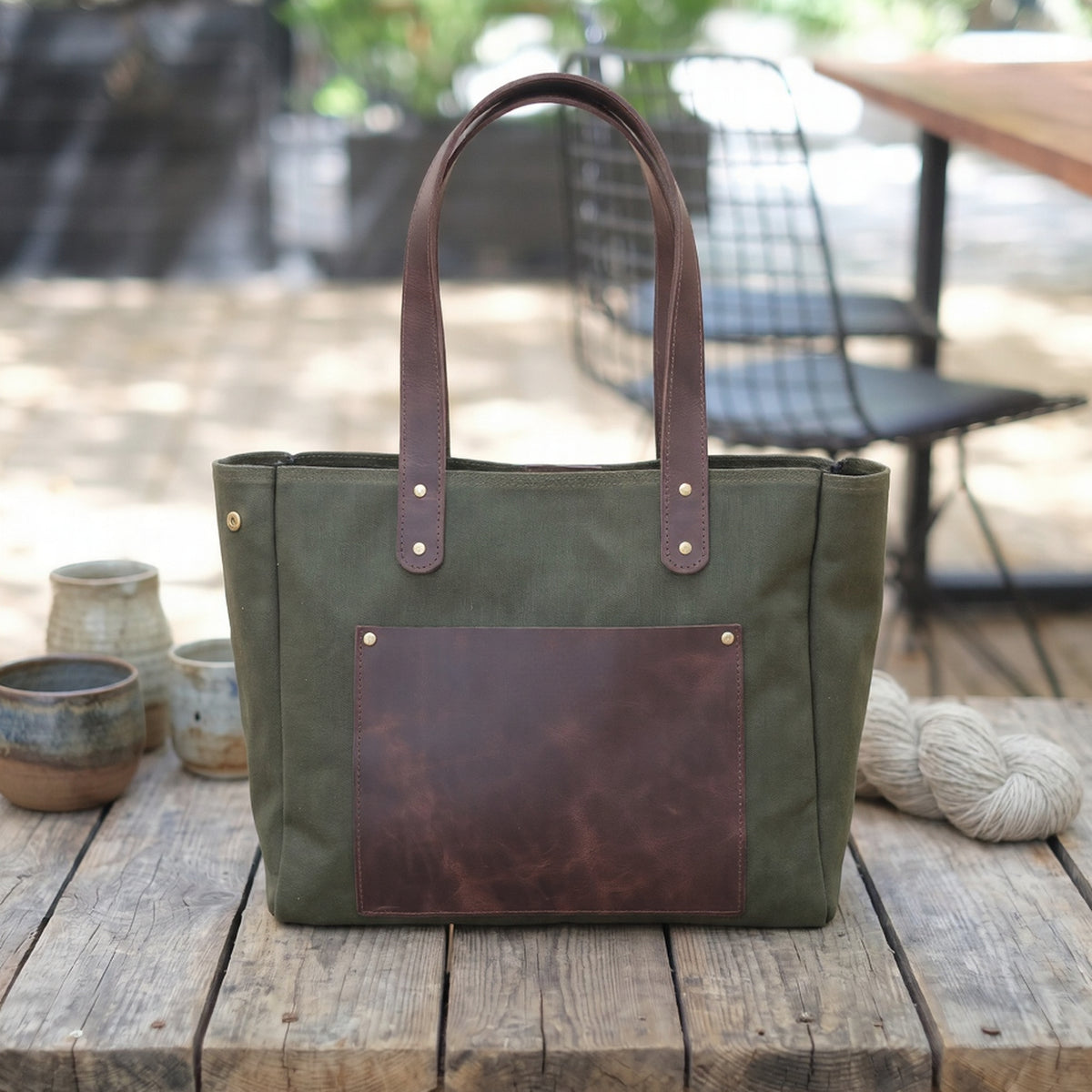 Verdelle handcrafted olive green canvas and brown leather tote bag front view - Yubello
