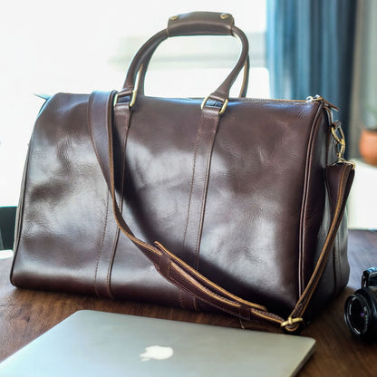 Vespera handcrafted chestnut leather travel duffle bag weekender side view - Yubello