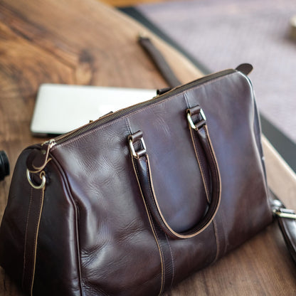 Vespera handcrafted chestnut leather travel duffle bag weekender side view - Yubello