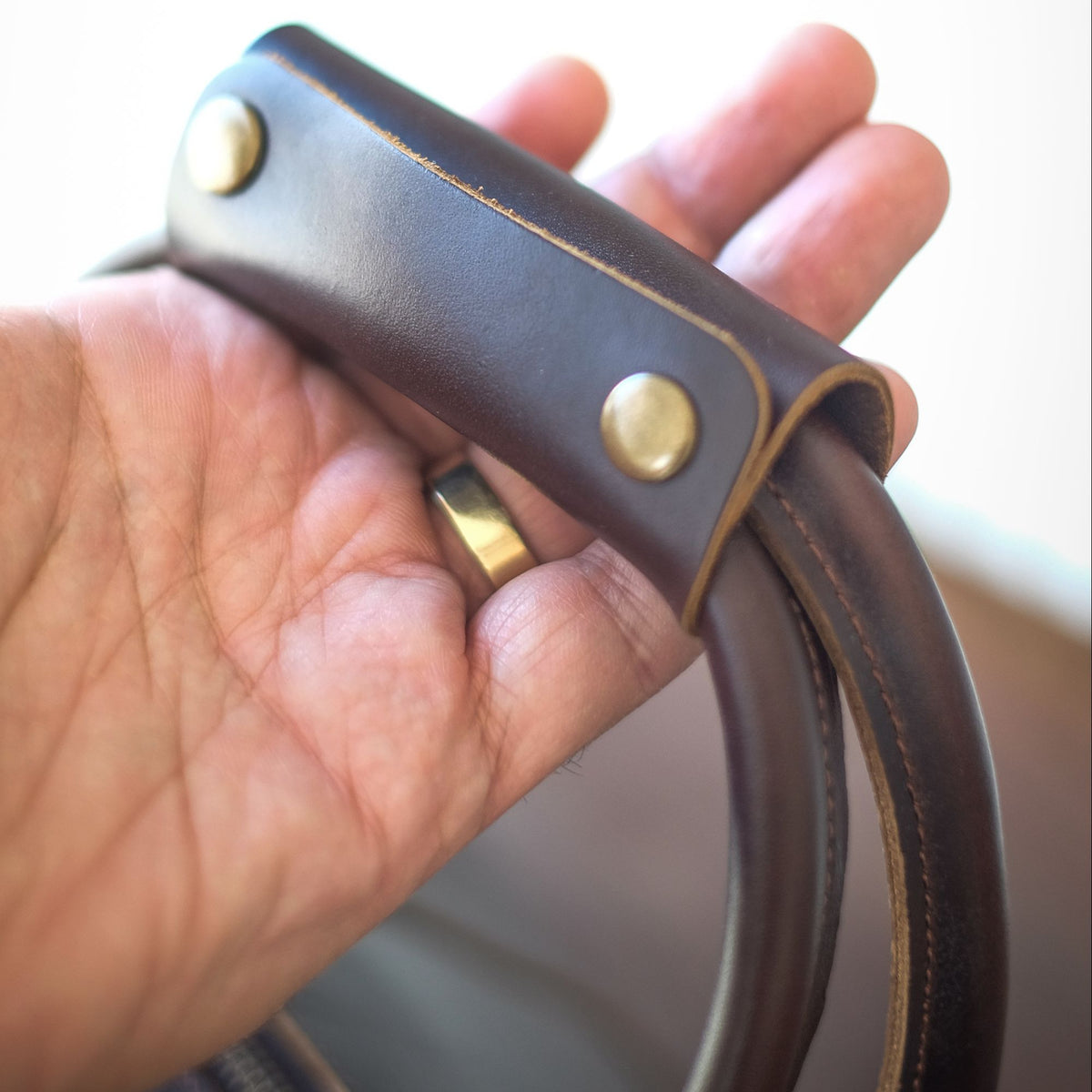 Vespera handcrafted chestnut leather travel duffle bag weekender side view - Yubello